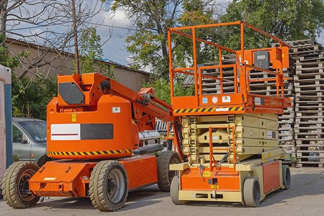 forklift operator working in busy warehouse environment in Chatfield